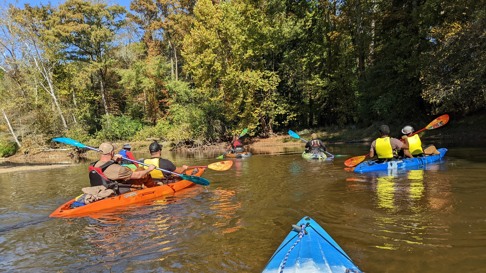The film crew kayaking down the river 