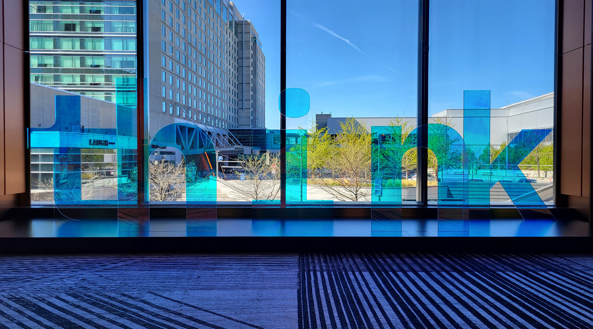 Signage in front of a window that reads ‘think’ at the IBM Think conference