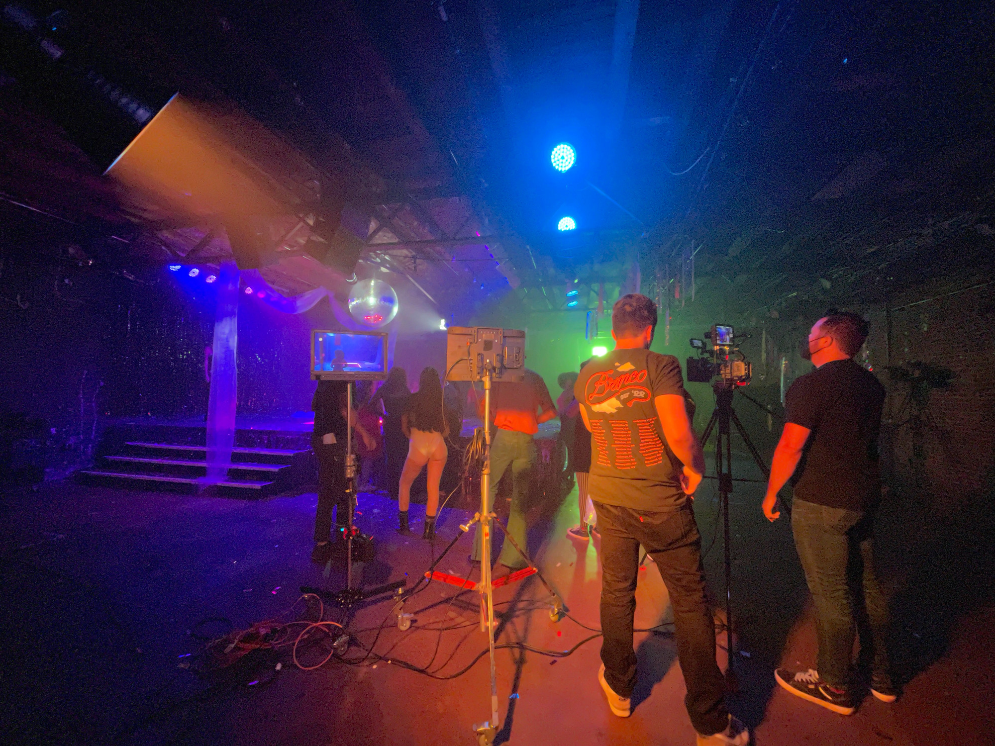 Behind the scenes of the production team filming a scene.