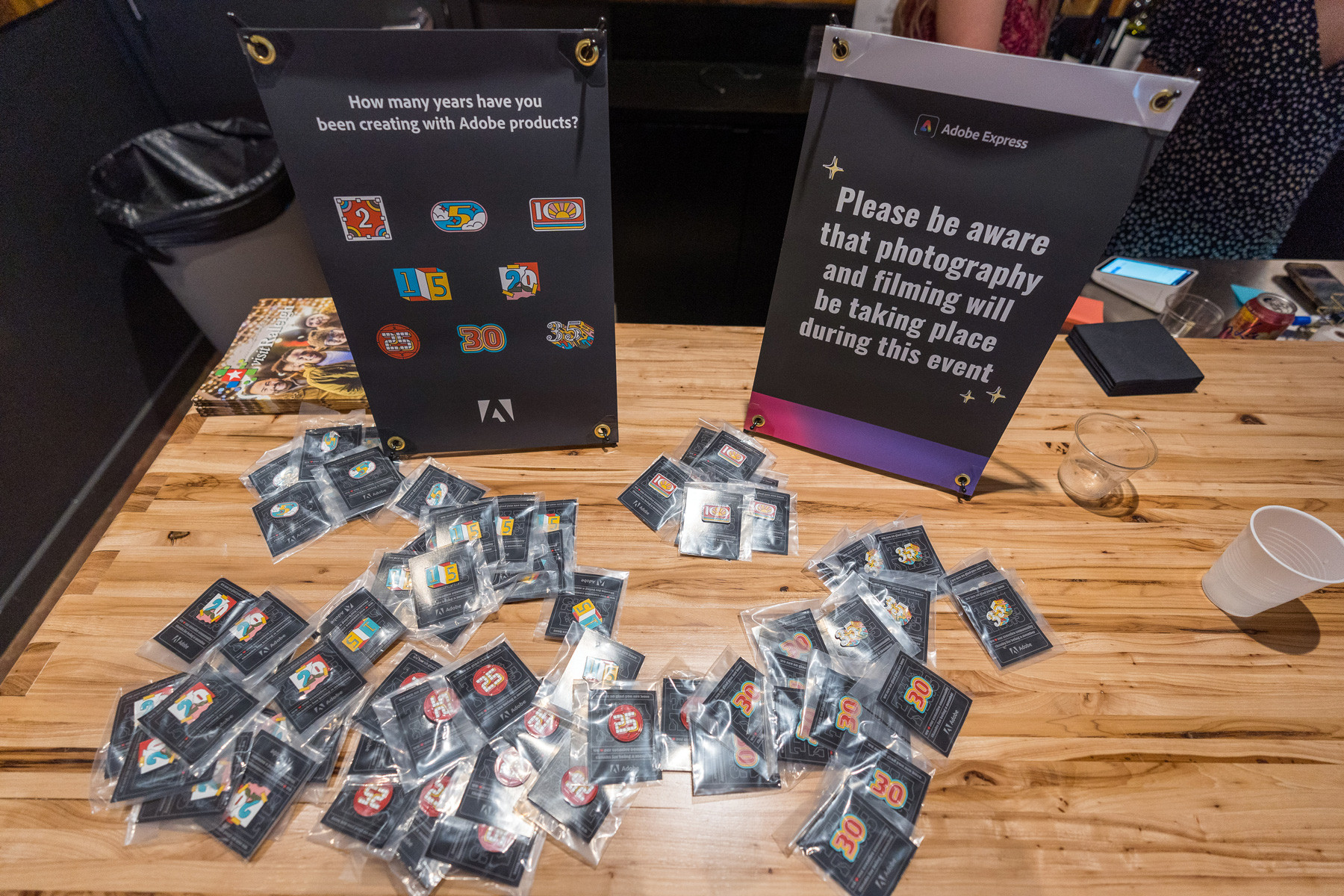 Adobe express stickers on a wooden table.